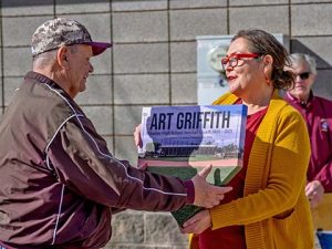 Mayor Birdie Cano (right) presented Coach Art Griffith (left) with an award from the city in the shape of a baseball base.