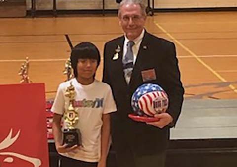 Thells Baker (left) is the winner of the 10 to 11-year-old boys state hoop shoot competition. He’s pictured here with Arizona Elks State President Albert Kayal (right).