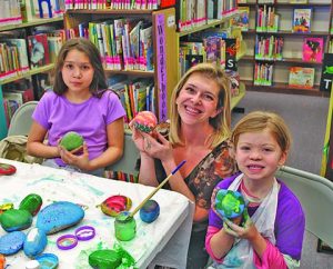 Madeline Baca (left), Jessica Lewis (middle) and Evee Myers (right) all attended the “Valentine’s Rocks!” event at the Winslow Public Library last week. People of all ages attended the event hosted by local artist Stephanie Myers to paint a rock for Valentine’s Day. This is one of the many events held for free to the public by the Winslow Public Library.