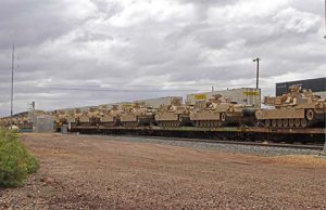 This train in Winslow carrying military tanks and equipment was one of many that came to an unexpected halt following a derailment near Chambers, east of Holbrook along I-40. The incident, which involved no reported injuries, caused significant disruption including shutting down I-40 east to traffic for two days as authorities worked to secure the site and assess the situation.
