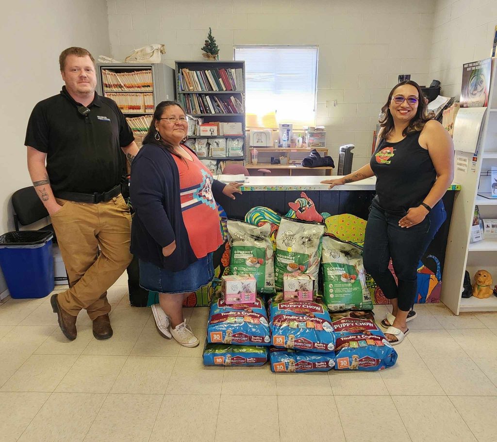 The Cherry Bombs, a charitable organization serving Holbrook, Joseph City and Winslow, recently donated over 200 pounds of puppy and kitten food to Holbrook Animal Control to help provide for the overflow of animals at the shelter. Pictured are (left to right) Animal Control Officer Brandon Smigiel and Cherry Bombs Veronica James and Tanisha Gamez.