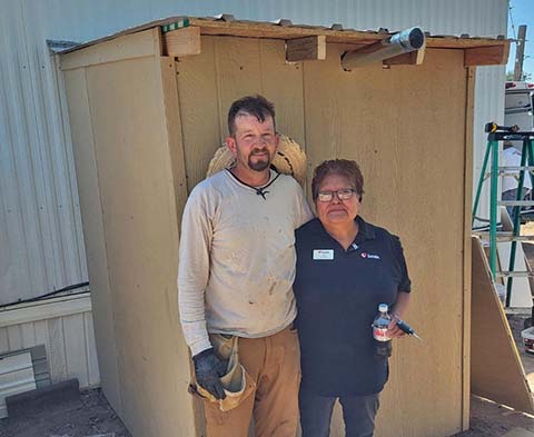 When it became known that Joseph City resident Luci Taha (right) was out of hot water last week, residents in the community do what comes naturally in that small town, they responded with love. Without hesitation residents donated funds to purchase a new water heater and Derron Hansen (left) jumped right in to help put it in. When he found out that the heater would need to be housed, residents Justin Kelley, Aaron Petersen, Brian Frost, Clarence Hansen, Mike Hansen, Justin Clifford, Blaine Randall, Howard May and Keith Holt answered the call and brought their skills and supplies and put everything together in record time to help a neighbor in need.