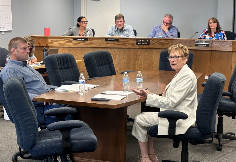 New City Manager Sharon Jakubowski Wolz (seated on the right) addressing the audience while discussing an upcoming meet and greet. Also pictured is Finance Director Randy Sullivan (left) and (left to right) City Clerk Lisa Hunt, Councilwoman Karina Pack, Councilman Robert Black, Vice Mayor Mike Nilsson and Mayor Kathleen Smith.