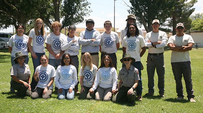 Those working in Youth Conservation Corps (YCC) include (front row, left to right) Park Guide Victoria Philpott, Ria Barela, Alisa Johnson, Susannah Roberts, Elena Philpott, Park Ranger Desiree Dye, (back row) Denessa Begay, Elenor Hansen, Riley Quinn, Emery Yazzie, Kardell Morris, Ezekial Knight, Skyler Joe, Ephriam Benally, AZCC Mentor Nataani Jacques and AZCC Mentor Nathan Pimienta.