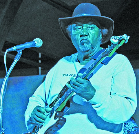Blues legend Tommy Dukes appropriately bathed in a blue hue during his set performing for those in attendance at the Winslow Arts Council’s annual Food Art Blues (FAB) Festival held last week in historic downtown Winslow.