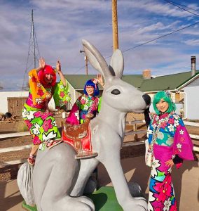 A Japanese musical group enjoyed a trip down Route 66 including an iconic by pose with the jack rabbit at Jack Rabbit Trading Post near Joseph City. Pictured are (left to right) Susie, Komako and Martha of Bentenya.
