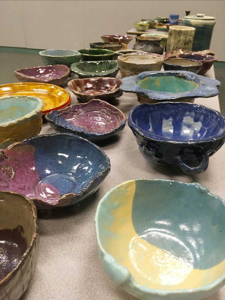 Handmade ceramic bowls crafted by community members will serve a simple meal of soup and bread to NPC’s Empty Bowls soup kitchen participants.