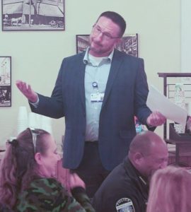 Travis Udall (standing), CEO of Little Colorado Medical Center, presented during Good Morning Winslow.