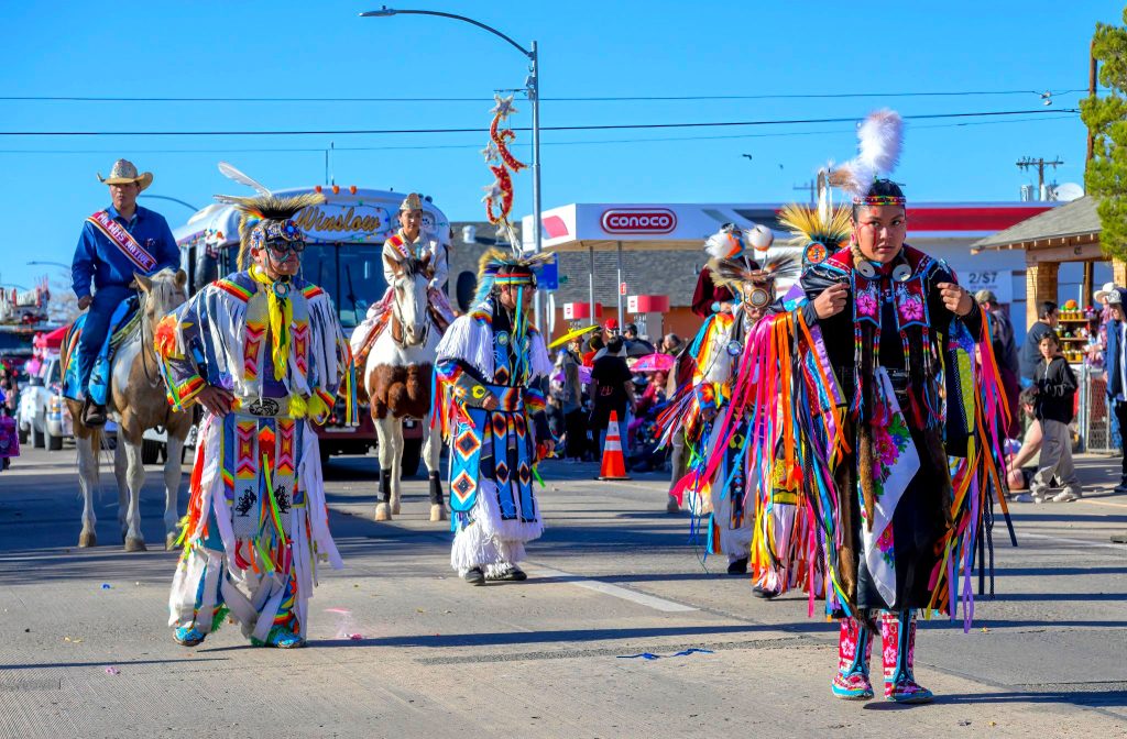 Dancers from Winslow High School’s Tribe of Many Feathers Club, a club for Native Americans of different tribes to come together to celebrate and represent their shared indigenous heritage, has one of the more spectacular showings at Winslow’s Christmas Parade held last Saturday.