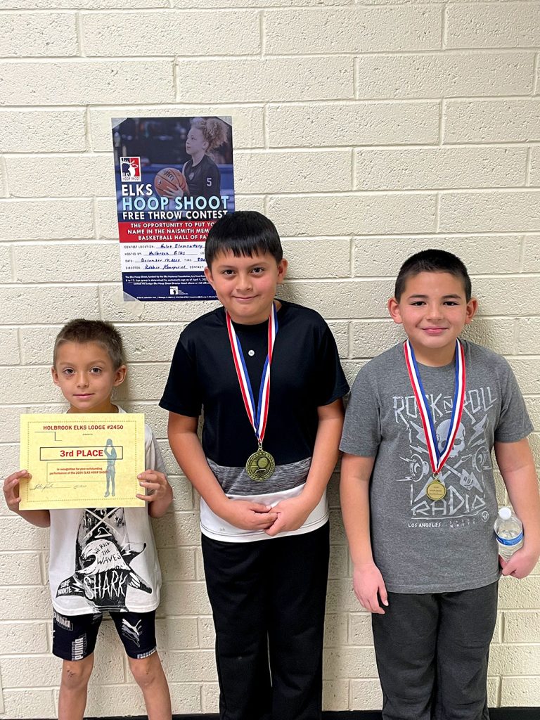 Winners in the 8 to 9-year-old boys’ category of the Holbrook Elks Hoop Shoot include Tucker Orton (center), first place with 20 baskets; Dominic Bordeaux (right), second place; and Tony Mann (left), third place.