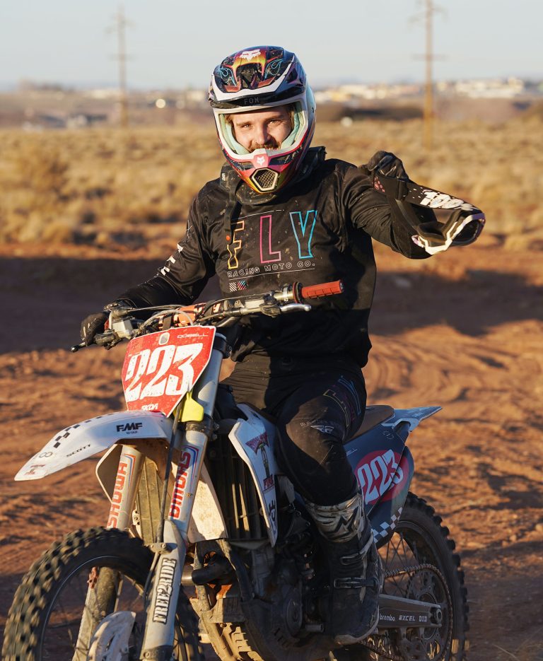 Uriah DoBell is all smiles after testing out Holbrook’s new motocross track, as Holbrook and county officials look on.