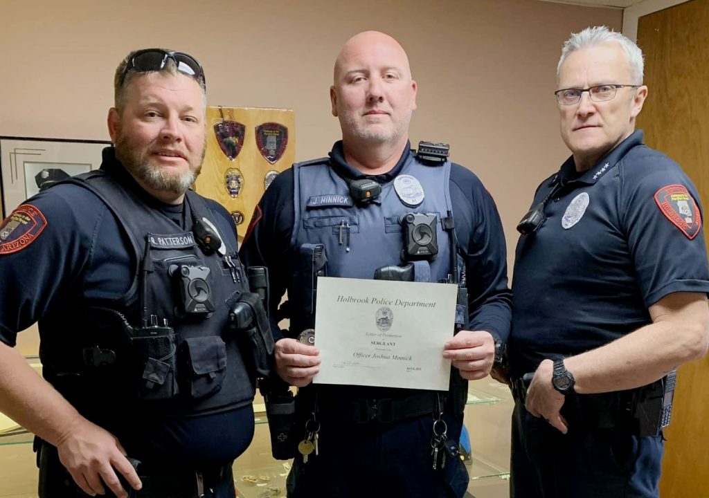 Holbrook Police Officer Josh Minnick (center) is shown here with Sgt. Ray Patterson (left) and Chief Nathan Christensen (right) after his promotion to sergeant. Fundraising efforts are underway for Minnick following a medical emergency.