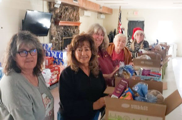 Members of the Holbrook Elks Lodge helped those in need by packing food boxes during the Christmas holiday at the Holbrook Senior Citizens Center. Pictured are (left to right) Darlene Brinkerhoff, Rosalie Harrelson, Cindy Allen, Beverly Goodnight and Phil Cobb.