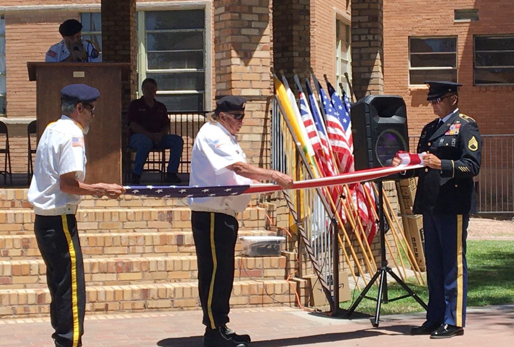 The Holbrook Elks Lodge No. 2450 and American Legion Post No. 37 held a Flag Day event on June 14, at the Old Courthouse. It included a telling of the history of the flag and the response. Members of the Holbrook American Legion No. 37 talked about what the fold means in the care of the flag and salute. Pictured are (left to right) Jimmy Kennedy, Gordie Ferrigel and Eric Baldonado showing the proper folding of the flag.
