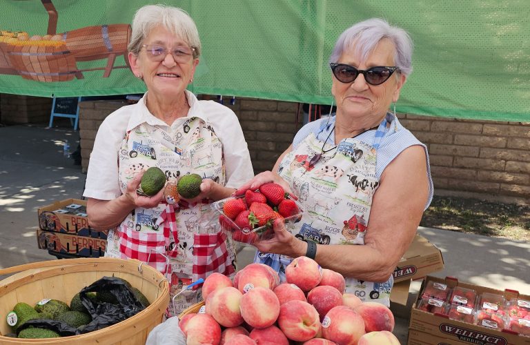 Winslow’s Mother Road Farmers Market is in full swing, with a wide variety of vendors to choose from. Here volunteers Kathy DeWitt (left) and Sally Lashomb (right) are excited to offer fresh fruits and vegetables at the market. The market is open from 9 a.m. to 1 p.m. every Saturday at the corner of Second Street and Williamson Avenue.