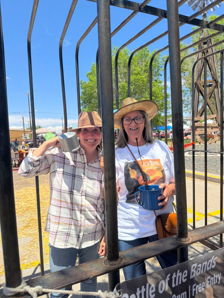 Holbrook’s Mayor Kathleen Smith (left) and Councilmember Teri Tafoya (right) remained in good spirits despite being jailed in 90-degree weather, all for a good cause to raise funds for the chamber and Holbrook Animal Control.