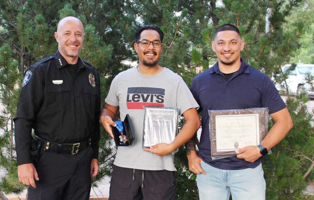 Snowflake-Taylor Police Chief Bobby Martin (left) presented citizen Miguel Martinez (center) with the Meritorious Conduct Award for his courageous and selfless actions on May 21, when he stepped in to assist STPD Officer Robeto Alvarado (right) in bringing a dangerous situation under control. Officer Alvarado received the Chief’s Commendation for his exceptional professionalism and unwavering composure in the same incident. Alvarado was transporting a suspect when he escaped his handcuffs and climbed into the front of the vehicle cab and struggled with the officer. Alvarado was able to safely stop the vehicle and Martinez, who was traveling along the same road assisted Alvarado in safely restraining the suspect without incident.