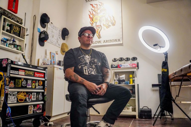 Tattoo artist and painter Yancey Katoney sits inside his Spotted Toad Tattoo Shop at Broken Focus Studio in Winslow, the creative space he now shares with fellow Native artists Randall and Cheri Sahmie.