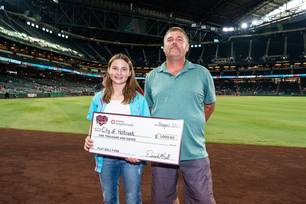 The City of Holbrook was honored as a 2025 Play Ball Fund grant recipient, presented by Arizona Complete Health and the Arizona Diamondbacks Foundation. As part of the celebration, City Manager Randy Sullivan (right) and youth athlete London Gardner (left) had the opportunity to step onto Chase Field and accept the award before the Diamondbacks faced off against the Cleveland Guardians on Aug. 19. This $1,000 grant recognizes the city’s dedication to supporting youth athletes.