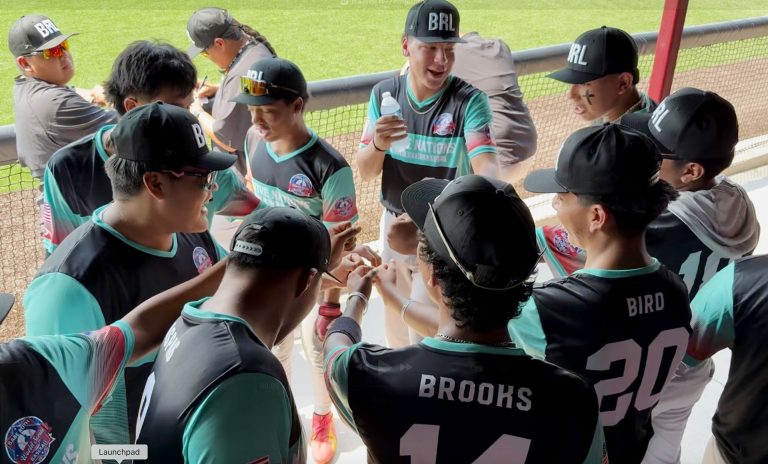 Na7ive Na7ions teammates prepare to take the field during the Babe Ruth World Series.