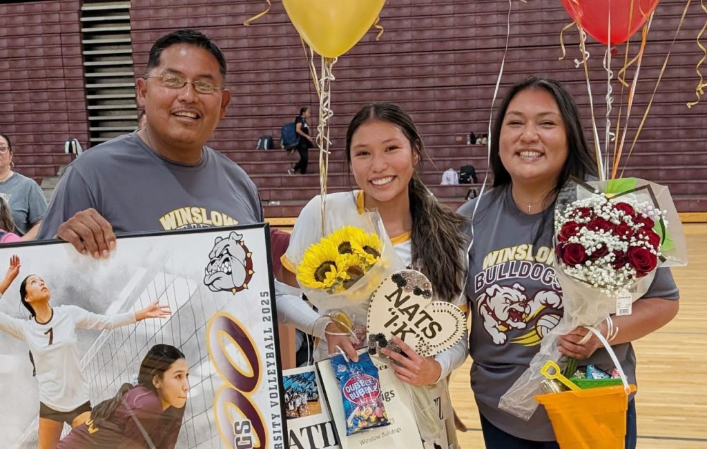 On Sept. 23, prior to the start of the Winslow vs Alchesay match, senior Natilyn Nez (center) was honored for getting her 1,000th dig. Also pictured are Nez’s proud parents Ferlin and Danielle Nez.