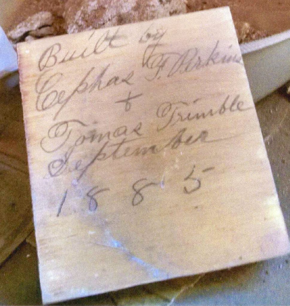 A block of wood discovered during renovation bears the signatures of Cephus Perkins and Tomas Trimble, two prominent early Holbrook residents who built the home in 1885.