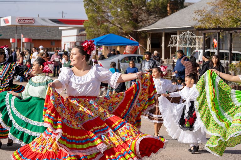 Las Aguilas De Oro Folklorico dancers brought the parade’s Fiesta Christmas theme to life for the judges, their dancers lifting and sweeping their skirts as they moved along the route.