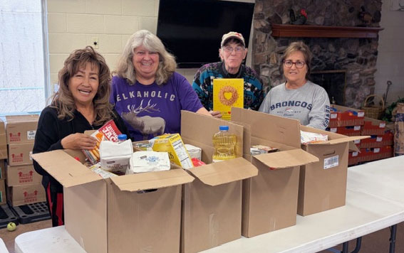 Holbrook Elks No. 2450 donated $2,000 to the Holbrook Senior Citizens Center for their Christmas food boxes. Last week members who helped to load some of the boxes included (left to right) Rosalie Harrelson, Cindy Allen, Phil Cobb and Vera Young.