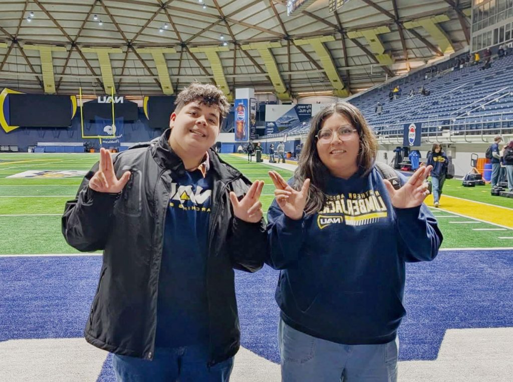 Caitlin Quiñonez (right) and Carlos Tafoya (left), both Winslow High School graduates, participated in the Macy’s Thanksgiving Day Parade as members of Northern Arizona University’s marching band.