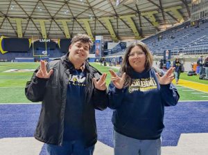 Caitlin Quiñonez (right) and Carlos Tafoya (left), both Winslow High School graduates, participated in the Macy’s Thanksgiving Day Parade as members of Northern Arizona University’s marching band.