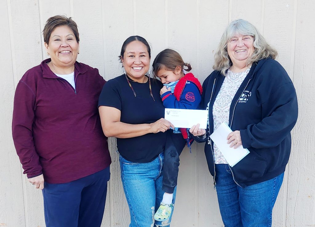 Holbrook Elks Lodge No. 2450 donated $4,000 to NAOMI (Native American Outreach Ministries) house in Joseph City, for HVAC repairs, a washer and dryer, a large commercial freezer and other needs. In addition, the Elks along with Santa took out Christmas gifts for each of the children on Dec. 20. The Elks received the grant fund from its Grand Lodge for meeting the Grand Exalter Rules ENF quota. Pictured are (left to right) Elks member Yolanda Lincoln, Joey Hemsoth and her child, and Elks member Cindy Allen.