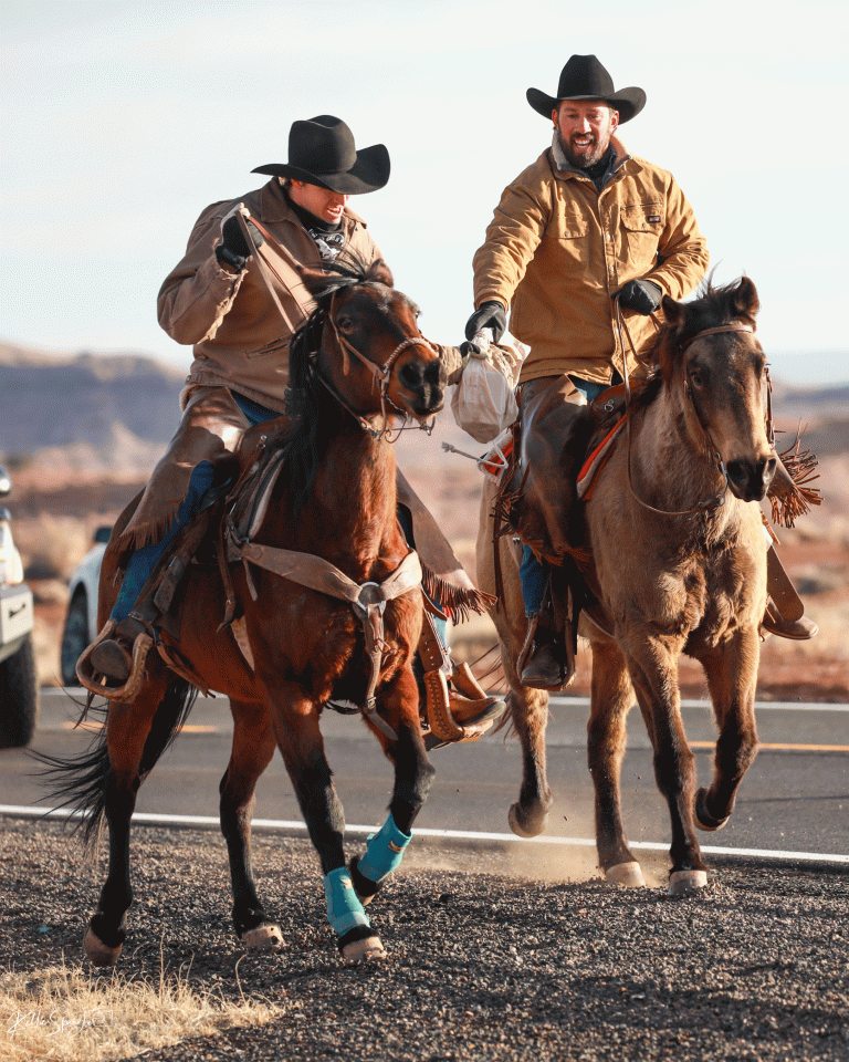 The Navajo County Sheriff’s Posse Pony Express Ride was held last week with the tradition of carrying local letters to the Scottsdale post office. The three-day ride finished with riders taking part in the procession in the Parada Del Sol. Pictured making a hand-off leaving Holbrook are Rex Self (left) and James Self (right).
