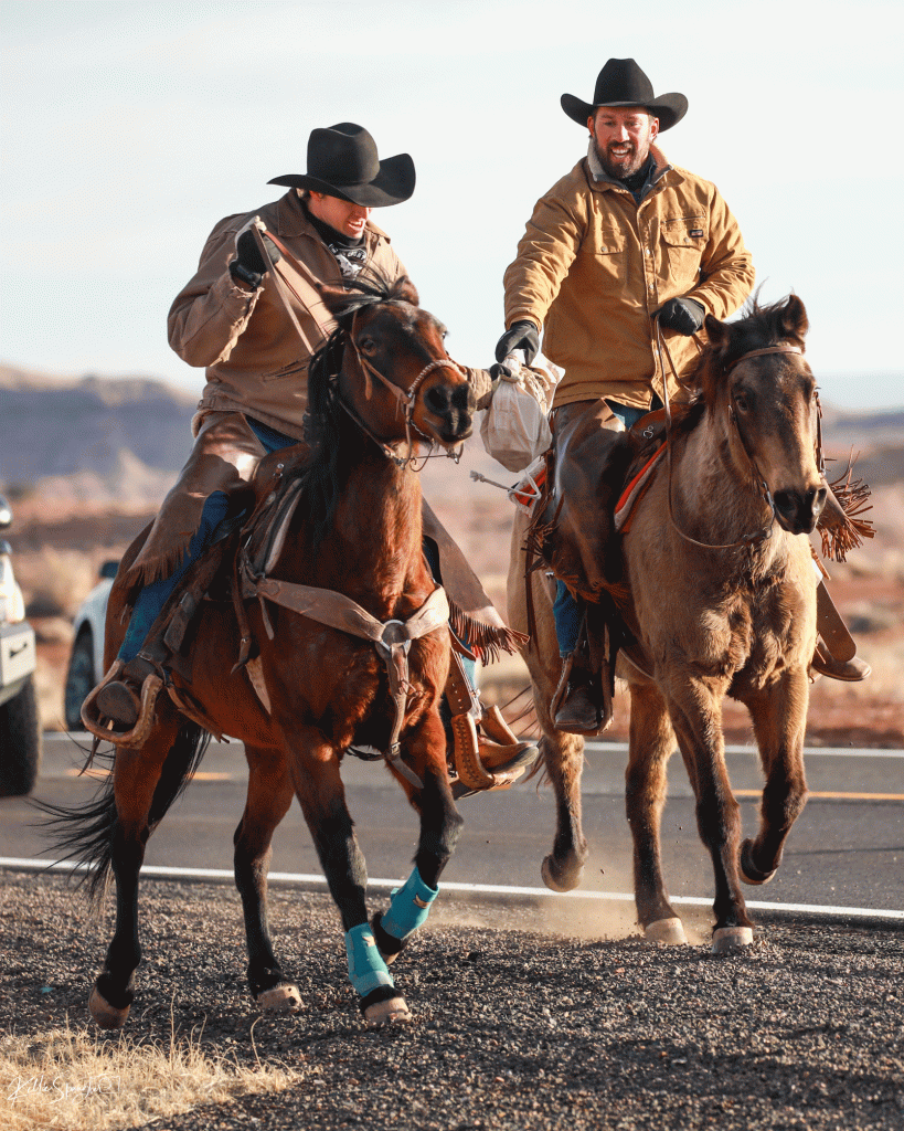 The Navajo County Sheriff’s Posse Pony Express Ride was held last week with the tradition of carrying local letters to the Scottsdale post office. The three-day ride finished with riders taking part in the procession in the Parada Del Sol. Pictured making a hand-off leaving Holbrook are Rex Self (left) and James Self (right).