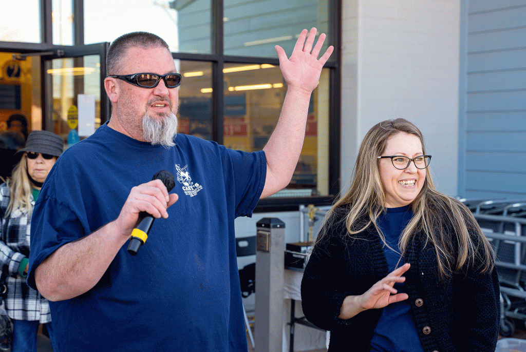 Kyle and Jody Johnson stand outside Casey’s Color Center during the store’s recent ribbon cutting ceremony. The couple took ownership on Jan. 1, and have spent the past several months restocking shelves and restoring the longtime Winslow business.