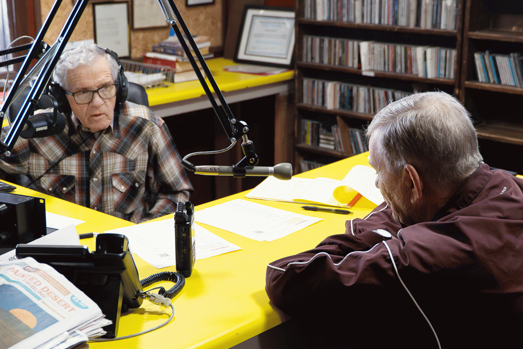 Loy Engelhardt (left) and Art Griffith share one last conversation at the KINO microphone on Feb. 28. During his final broadcast, Engelhardt played archival interviews with legendary Winslow coaches Emil Nasser and the late Becky Barris as listeners called in to say goodbye to the man who had narrated their town for nearly six decades. Engelhardt delivered his final sign-off after completing the noon news update.