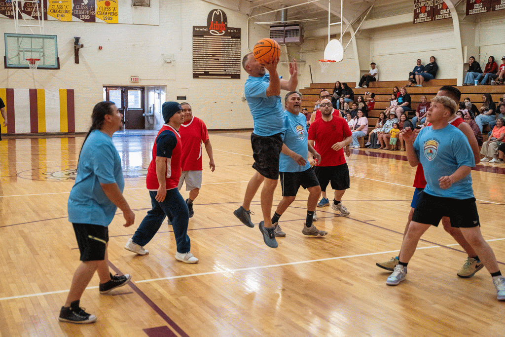 Public Works Director Tim Westover goes up for a layup during the City of Winslow’s second annual interdepartmental basketball game, where public works defeated the Winslow Fire Department 52–45 to claim the traveling trophy. Pictured are (left to right) Roman Baca (public works), James Martinez (fire department), Erik Kanhuo (fire department), Tim Westover and Thompson Bert (public works), Matthew Chadwick (fire department). Behind Chadwick is Fire Chief Mike Duran, with Angelo Guerrero (public works) and Sal Hernandez (fire department) in the background.