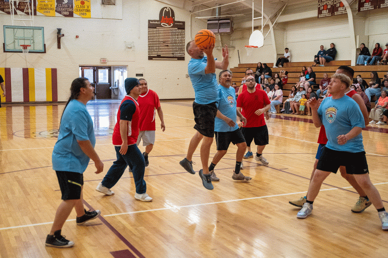 Public Works Director Tim Westover goes up for a layup during the City of Winslow’s second annual interdepartmental basketball game, where public works defeated the Winslow Fire Department 52–45 to claim the traveling trophy. Pictured are (left to right) Roman Baca (public works), James Martinez (fire department), Erik Kanhuo (fire department), Tim Westover and Thompson Bert (public works), Matthew Chadwick (fire department). Behind Chadwick is Fire Chief Mike Duran, with Angelo Guerrero (public works) and Sal Hernandez (fire department) in the background.