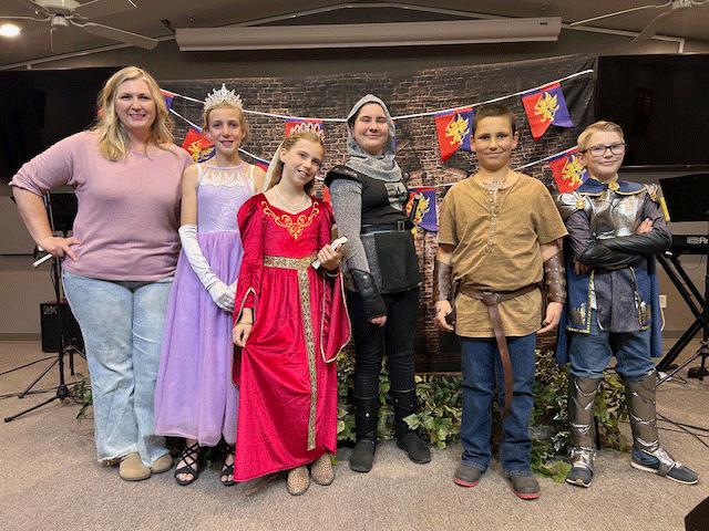 Classical Conversations, a Christ-centered homeschool community in Holbrook held its annual “Faces of History” presentations last week, blending writing, performance and storytelling. Over the course of the academic year, students selected historical figures and developed research papers which become the foundation for a final presentation delivered entirely in character, with students dressing in costume and speaking from a first-person perspective. Pictured are (left to right) Essentials tutor Brigette Brimhall, Clare Bonefield, Jessie Jolley, Kimber Lee, Cooper Bonefield and Liam Brimhall.