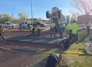 Image courtesy of the City of Holbrook / The City of Holbrook Parks Department was hard at work pouring concrete last week that will soon support shade structures, a response to a large shade tree that had to be removed after it died and became a hazard. Another addition will be a swing set near the shaded area.