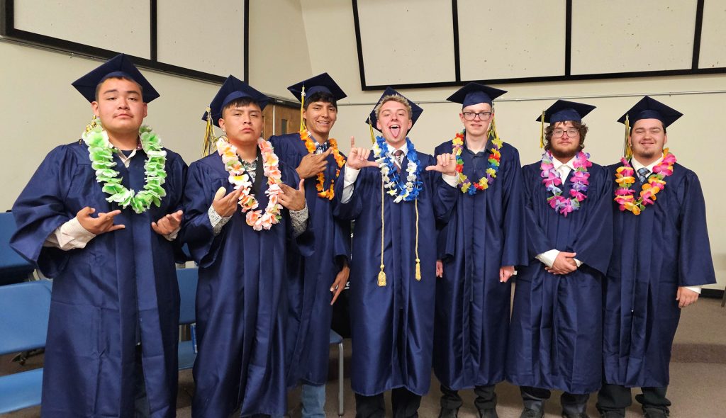 Classmates (left to right) Tatum Dixon, Jaimen Tsosie, Eli James, Cort Miller, Luke Miller, Leon Howerton and Wyatt Bowler stand together one last time as classmates before graduation.