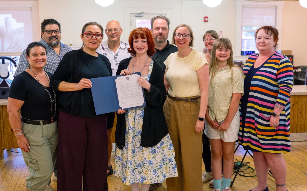 Winslow High School student Lindsey Cox stands with her family and the Winslow City Council. Pictured are (left to right) councilmembers Darcey McKee and Daniel Tafoya, Mayor Birdie Cano, Council member Jim MacLean, Lindsey Cox, her parents, Joe and Lauren Cox, Councilmember Samantha Crisp, Lindsey's sister, Samantha Cox and her aunt, Jessica Cox-Atha.