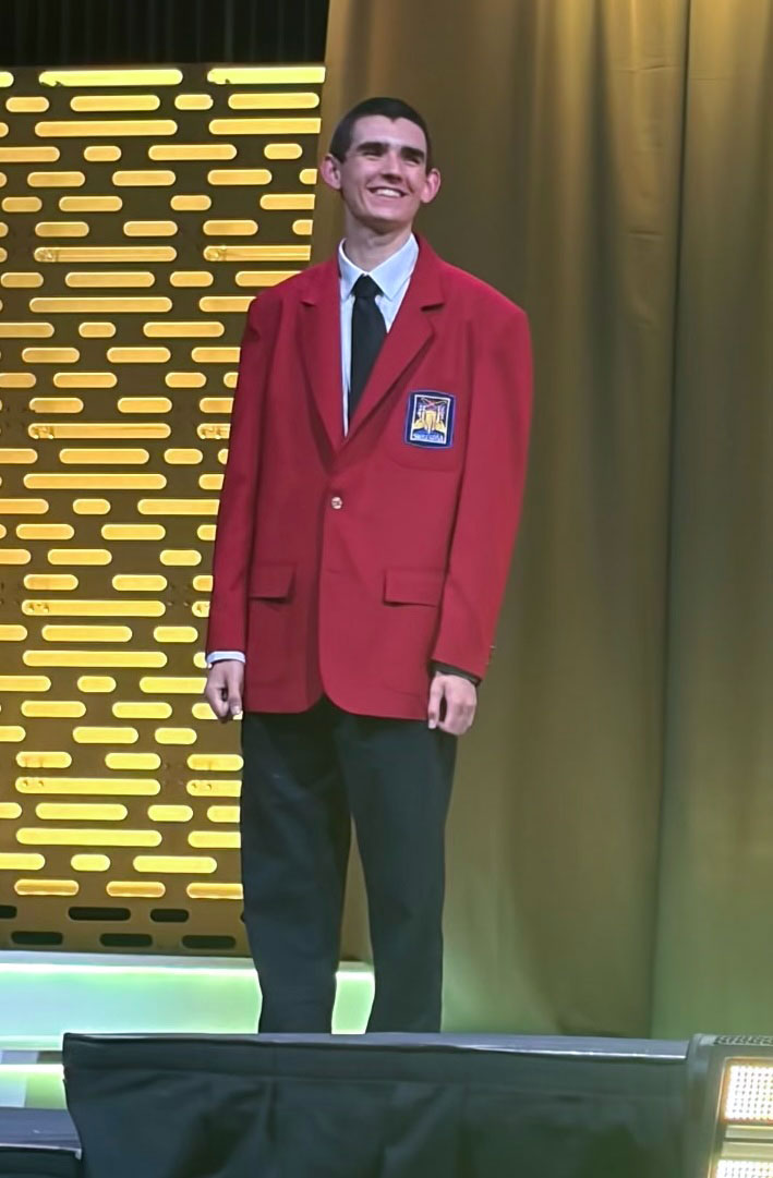 Jack Harris, in his red blazer, stands with fellow medalists at the recent SkillsUSA national competition in Atlanta, where he earned bronze in welding.