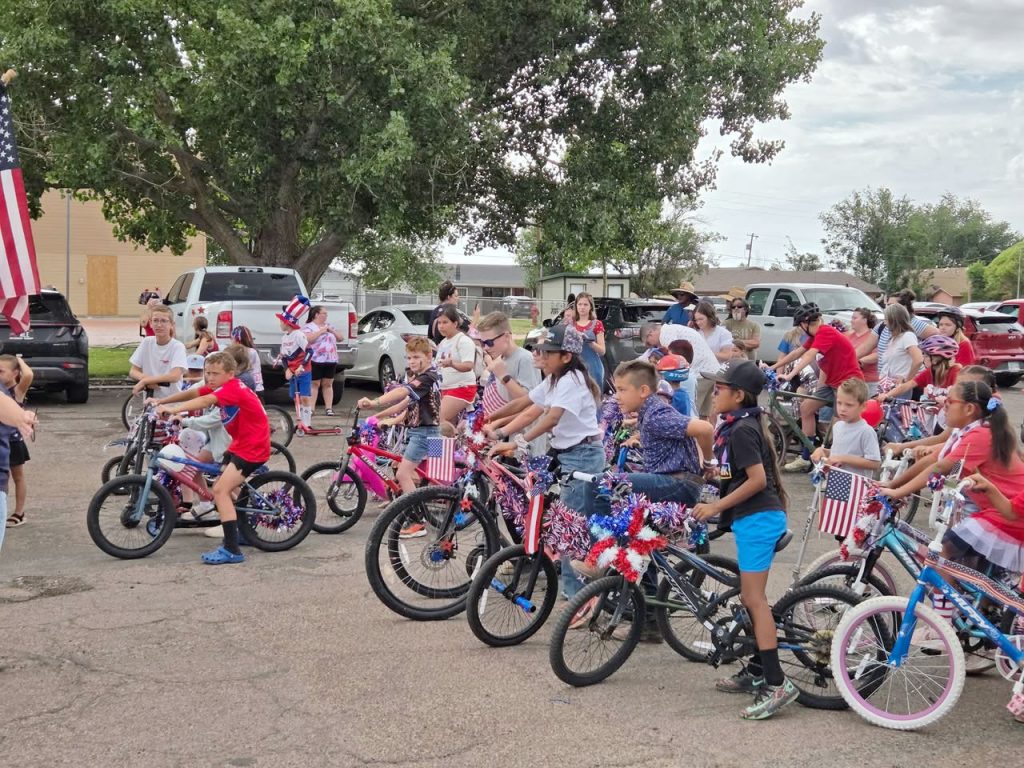Kids gathered at Hunt Park in Holbrook to take part in the annual Fourth of July Parade around the park after decorating their rides.