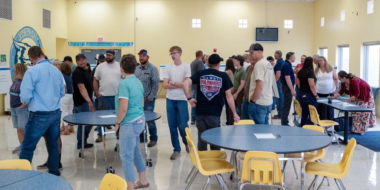 Community members gather at Joseph City Elementary School last week to learn about the next phase for Cholla Power Plant at an Arizona Public Service informational event. The gathering, which featured APS representatives and educational posters, marks the first public open house since the announcement that Cholla will be reopening as a natural gas plant, with operations anticipated to begin in 2029.