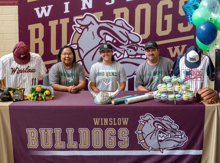 Ara Leonard (center) a May graduate of Winslow High School, signed her letter of intent to play softball at Big Bend Community College in Washington, with her parents Audrey (left) and Rich Leonard (right) by her side. Ara made history as the first female athlete to play on the WHS baseball team before committing to play softball at the college level.