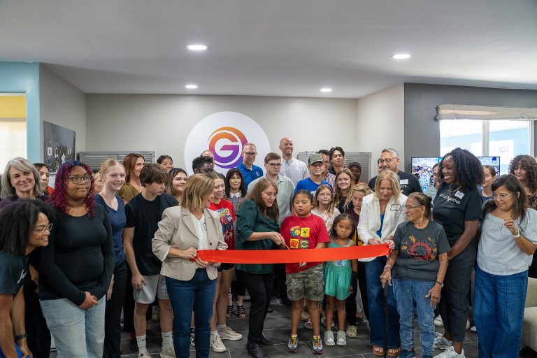 Grow Arizona CEO Kathleen Smith with the help of local youth cut the ribbon on the new Workforce Digital Skills Lab and shopfitting of the Bijou Shop.