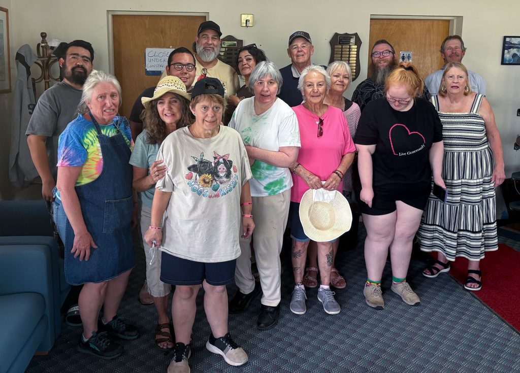 The Holbrook Kiwanis hosted its annual event at the Hidden Cove Golf Course for the First Step Workshop clients. The members of the organization grilled hamburgers and hot dogs and provided root beer floats. The fun included a drive around the golf course in the carts, playing corn hole and use of the putting range. The First Step Workshop provides training, employment and job supervision of adult handicapped individuals in Navajo County. Pictured are members of the Holbrook Kiwanis organization and clients of First Step Workshop.