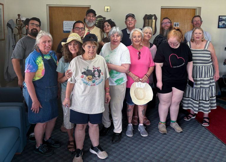 The Holbrook Kiwanis hosted its annual event at the Hidden Cove Golf Course for the First Step Workshop clients. The members of the organization grilled hamburgers and hot dogs and provided root beer floats. The fun included a drive around the golf course in the carts, playing corn hole and use of the putting range. The First Step Workshop provides training, employment and job supervision of adult handicapped individuals in Navajo County. Pictured are members of the Holbrook Kiwanis organization and clients of First Step Workshop.