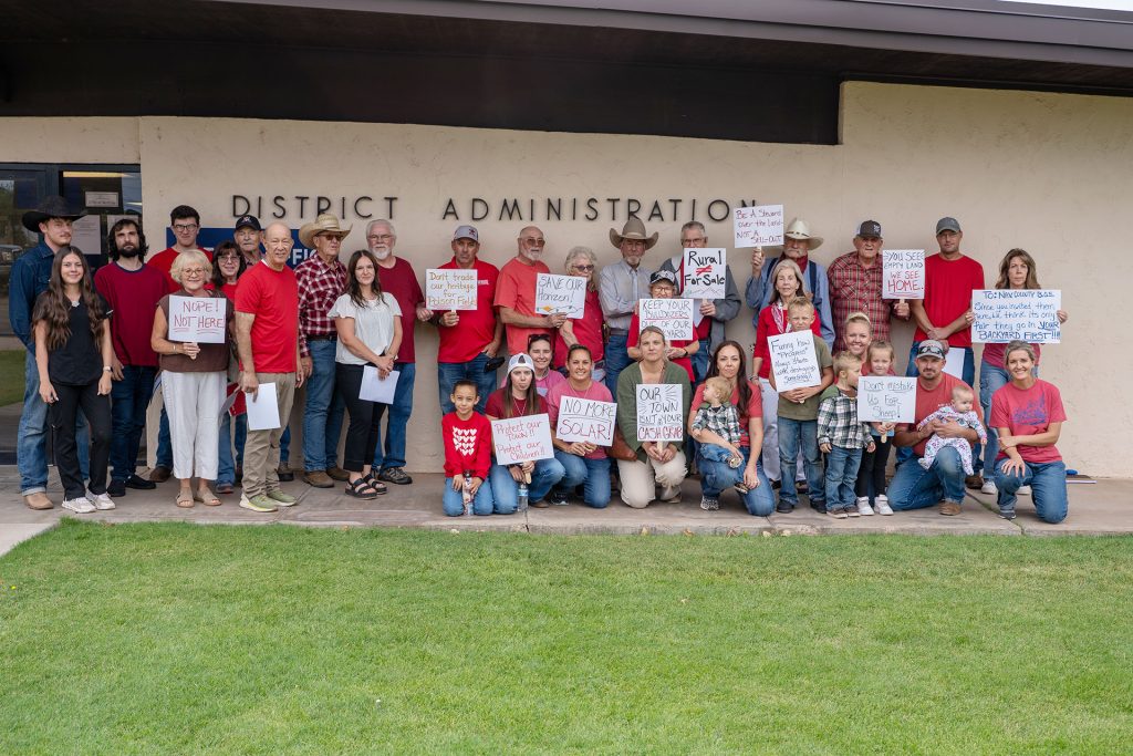 Residents opposed to Invenergy's proposed Honeymoon Trail Energy Center gather outside the Joseph City school district during last week’s open house.
