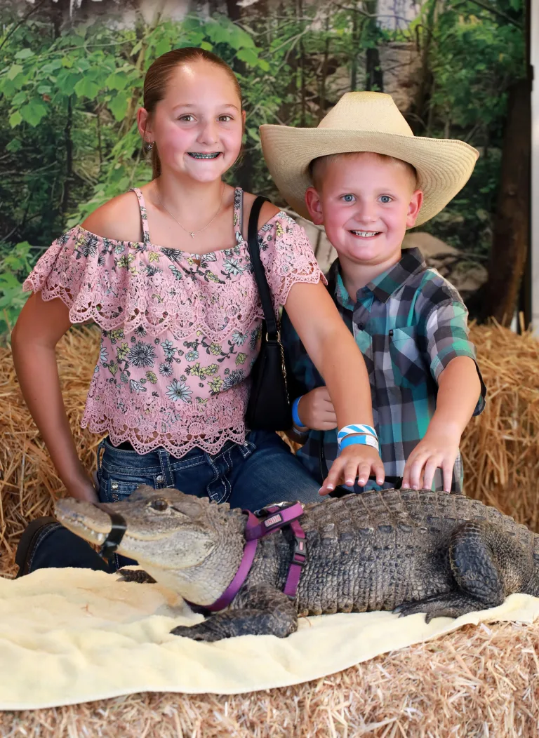 Most likely the only opportunity to pet a live alligator will be at the county fair and Taylor and Austin Young were sure to do just that.
